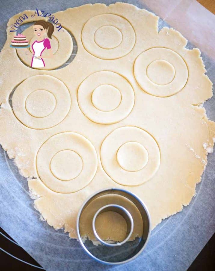 Cutting out cookies with a cookie cutter.