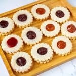 A tray with jam linzer cookies.