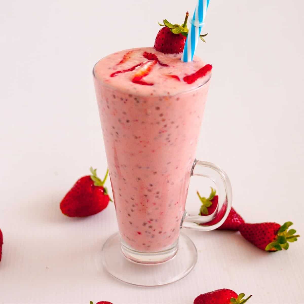 A berry smoothie in a tall glass.