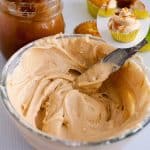 A bowl with buttercream and butterscotch sauce.