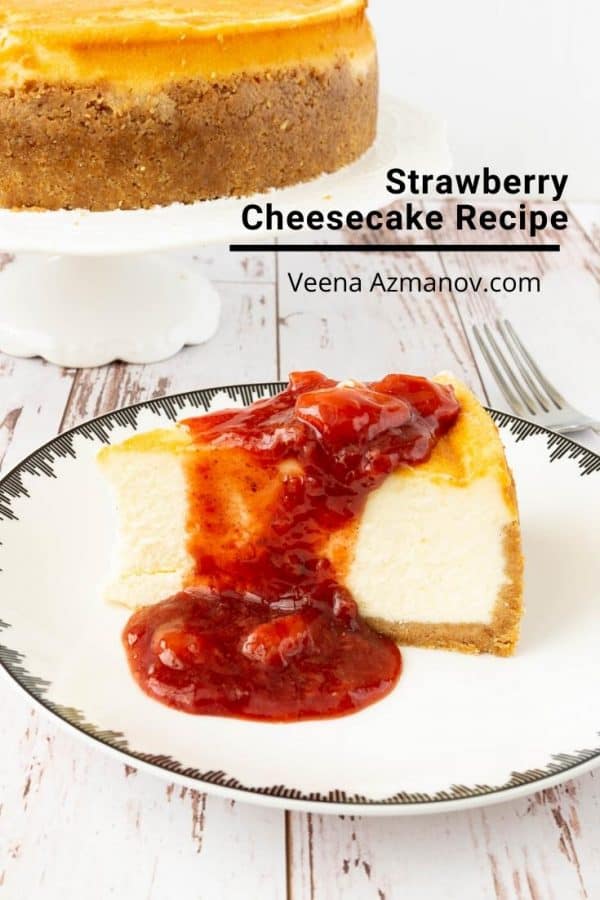 A slice of Cheesecake with strawberry sauce topping on a plate.