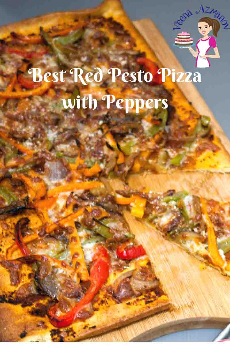 A sliced red pesto pizza with bell peppers.