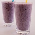 Two glasses of blueberry banana smoothie.