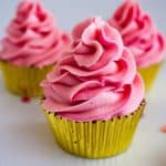 A frosted cupcake with champage