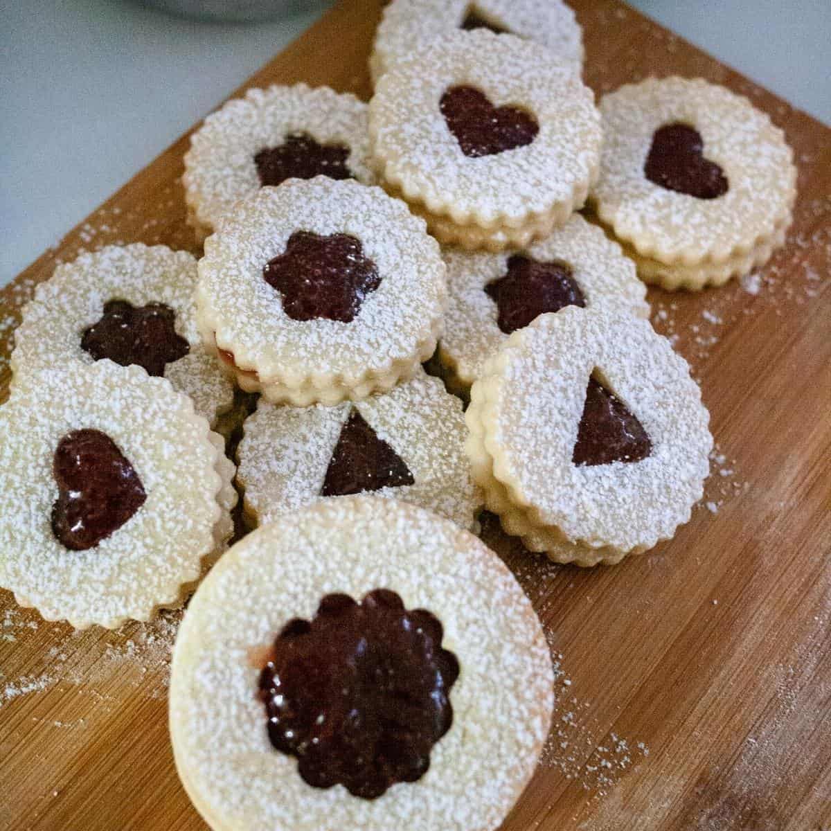 Linzer cookies on a wooden board