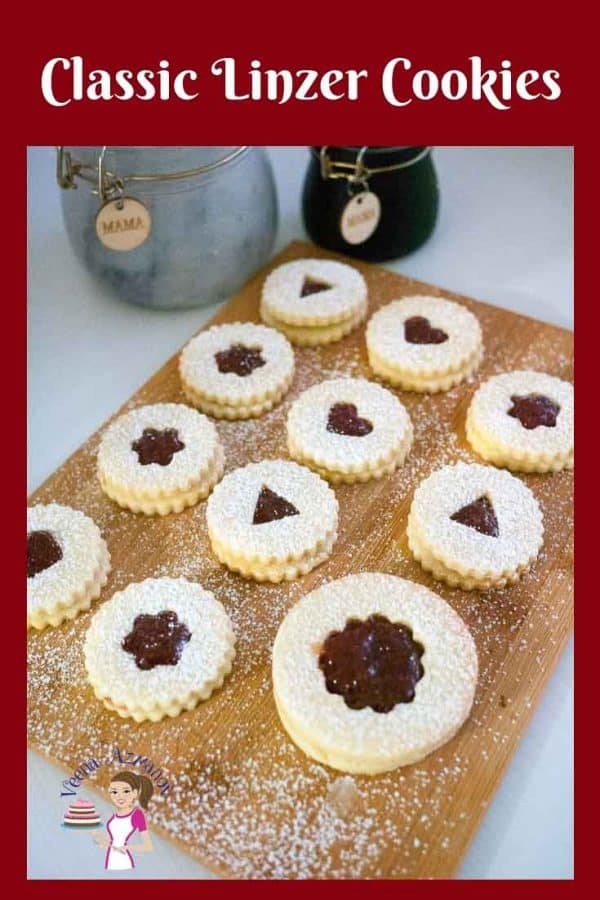 These classic Linzer cookies are battery crumbly shortbread jam sandwich cookies that make perfect holiday cookies to gift family and friends.