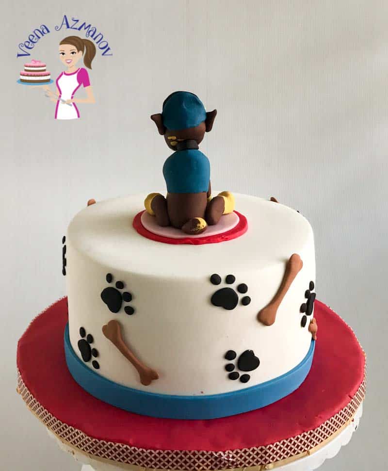 A birthday cake with a Paw Patrol topper.