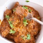 slow cooked beef in a serving dish.