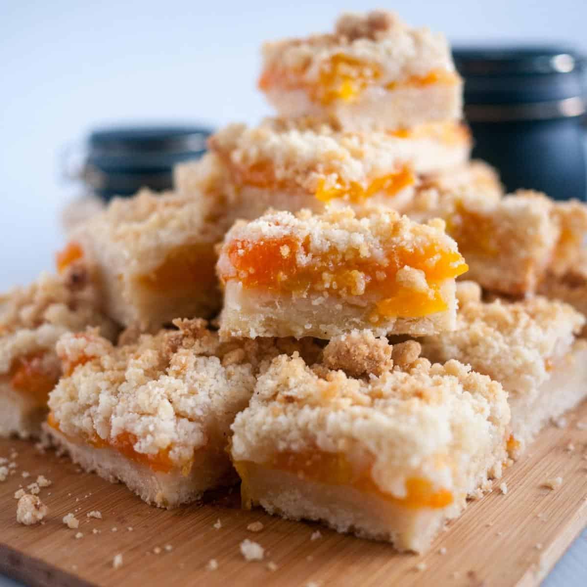 Crumble bars with apricot on the wooden board.