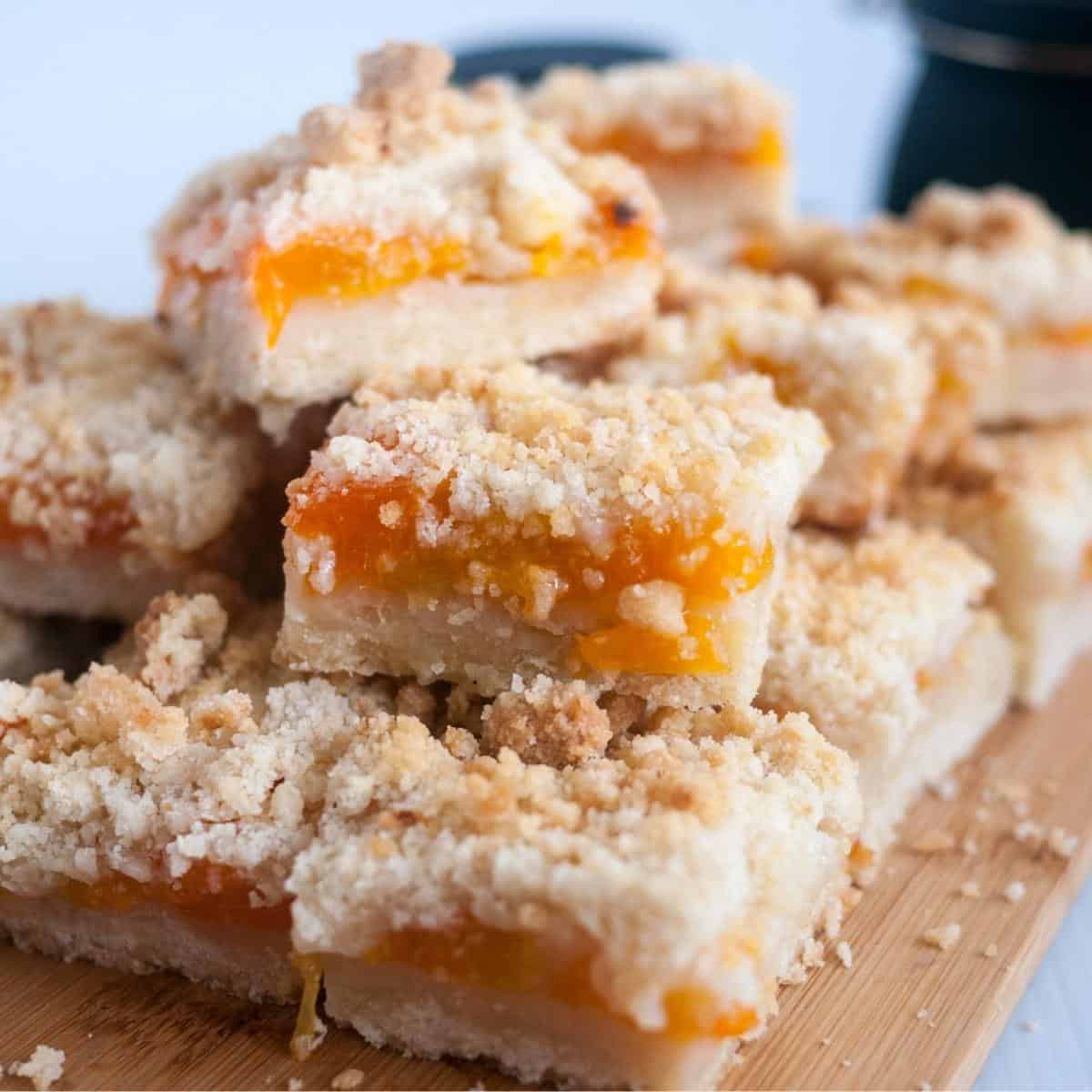 Apricot bars on a wooden board.