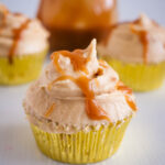 Butterscotch frosted cupcakes on display.