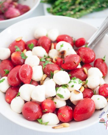 A white bowl with mozzarella and tomatoes