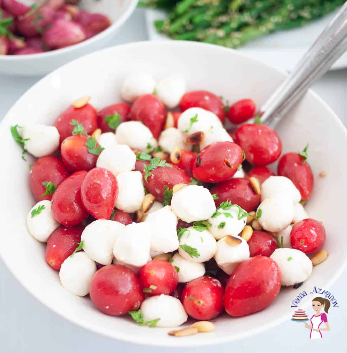 A white bowl with mozzarella and tomatoes