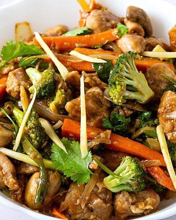 A bowl with chicken stir fry.