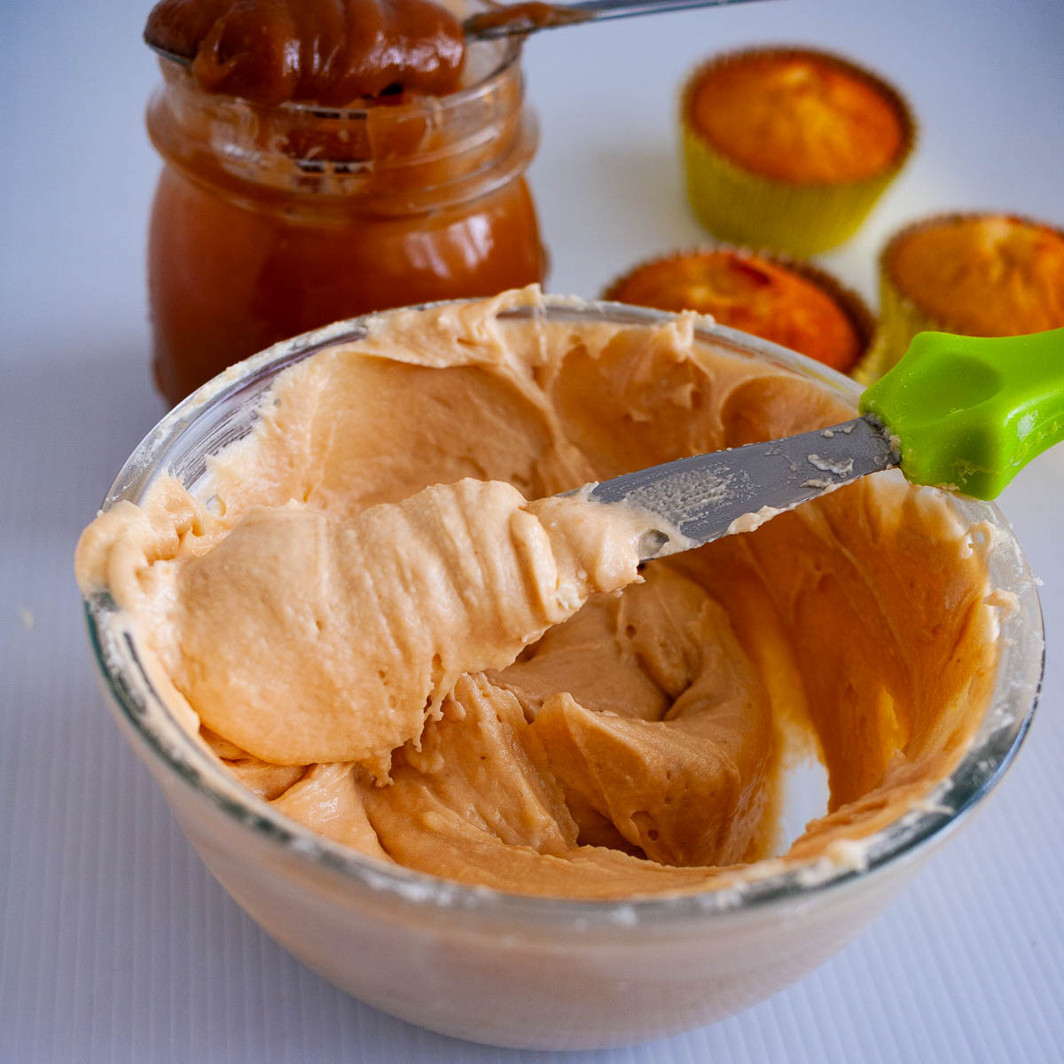 A bowl with butterscotch buttercream.