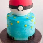 Fondant decorated cake on a board.