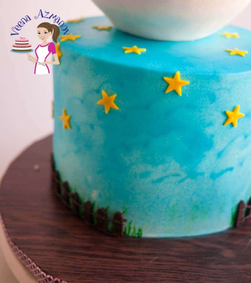 A close up of a cake decorated with stars.