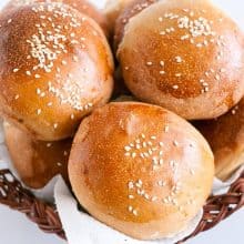 A basket with whole wheat buns.