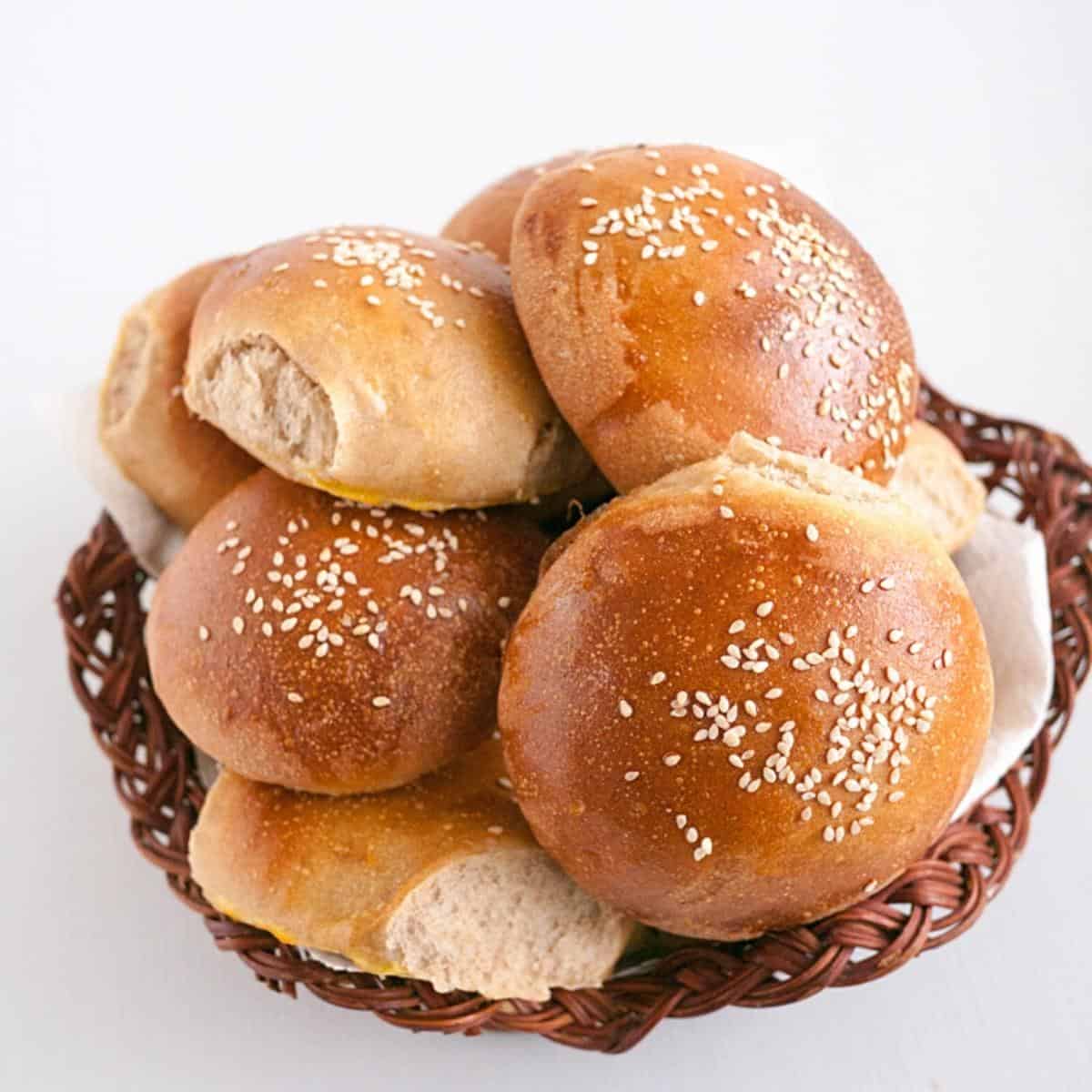 A basket with whole wheat buns.