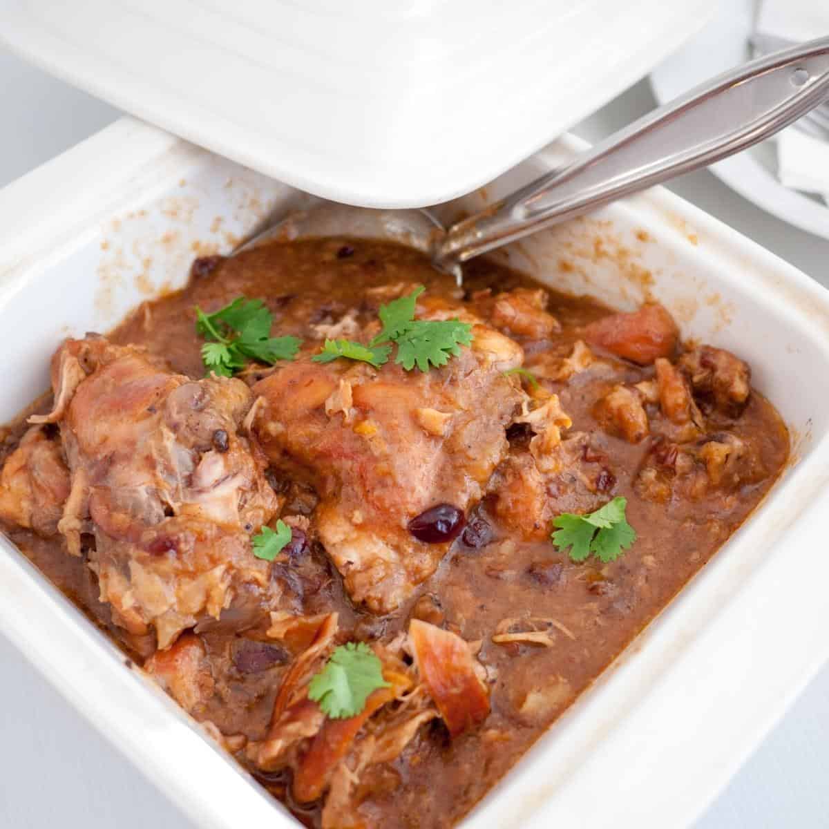 slow cooked apricot chicken in a serving dish.