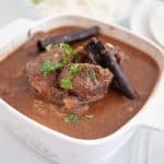 Slow cooked beef in a serving bowl.