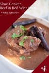 Slow cooked beef in a serving bowl.
