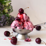 Ice cream bowl with fresh cherry ice cream.