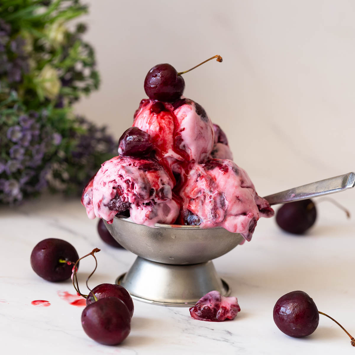 Ice cream bowl with fresh cherry ice cream.