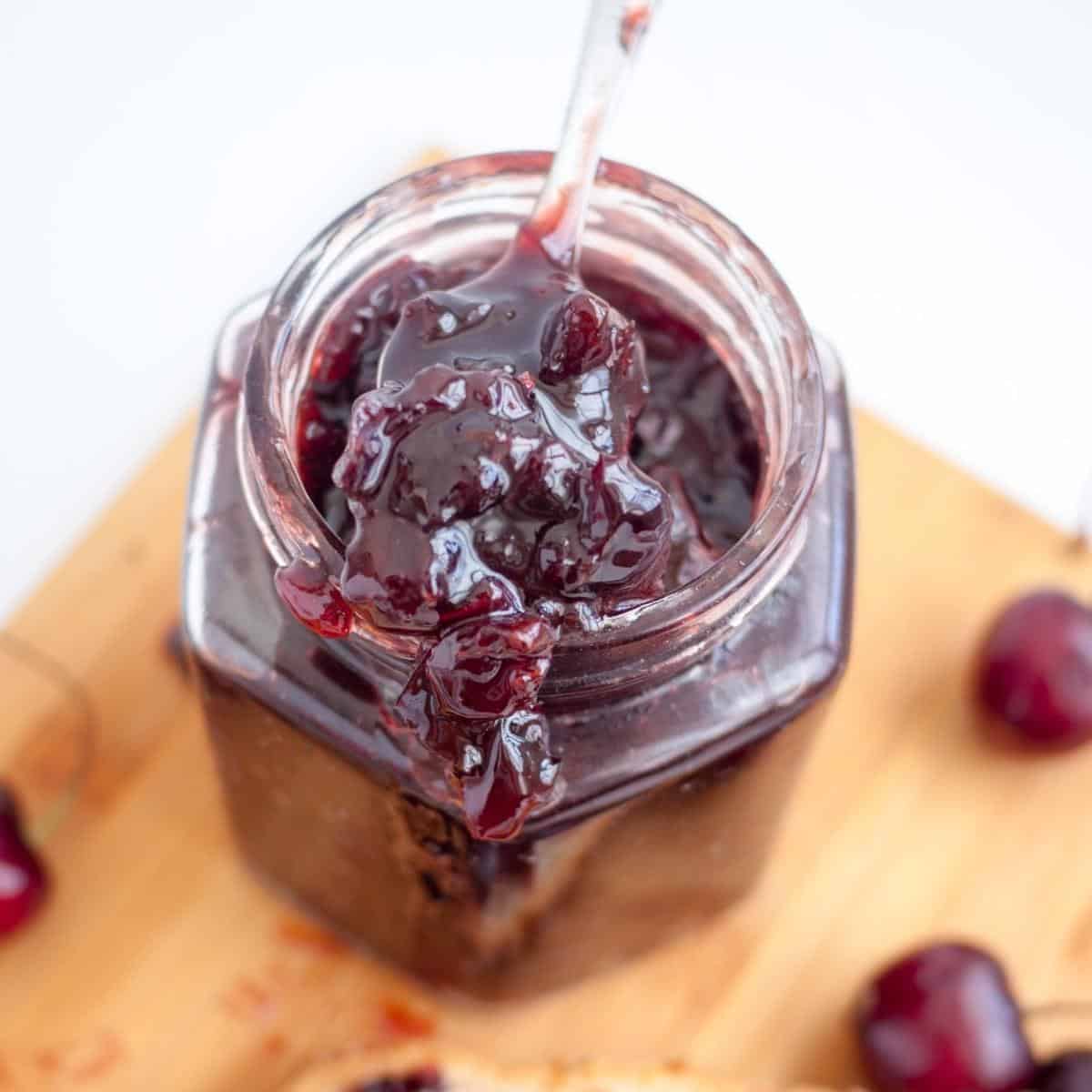 Mason jar with cherry jam.