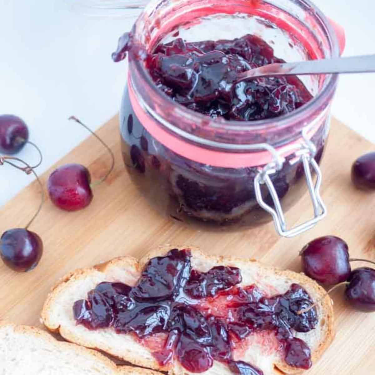A slice of bread with cherry jam.