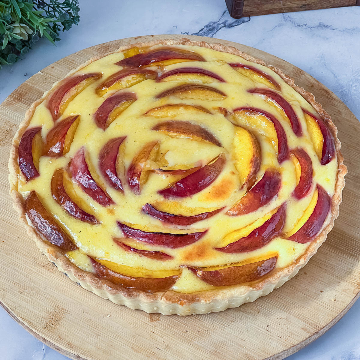 Fresh nectarine tart on the table.