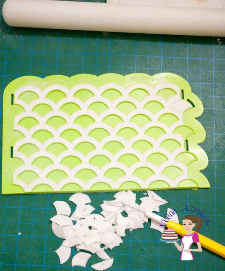 Making gum paste patterns with a silicon mold.