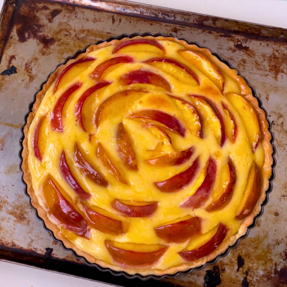 Progress pictures baked fruit tart with nectarines.