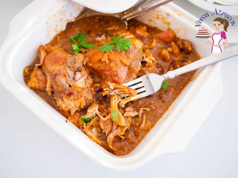 slow cooked chicken in a serving dish.