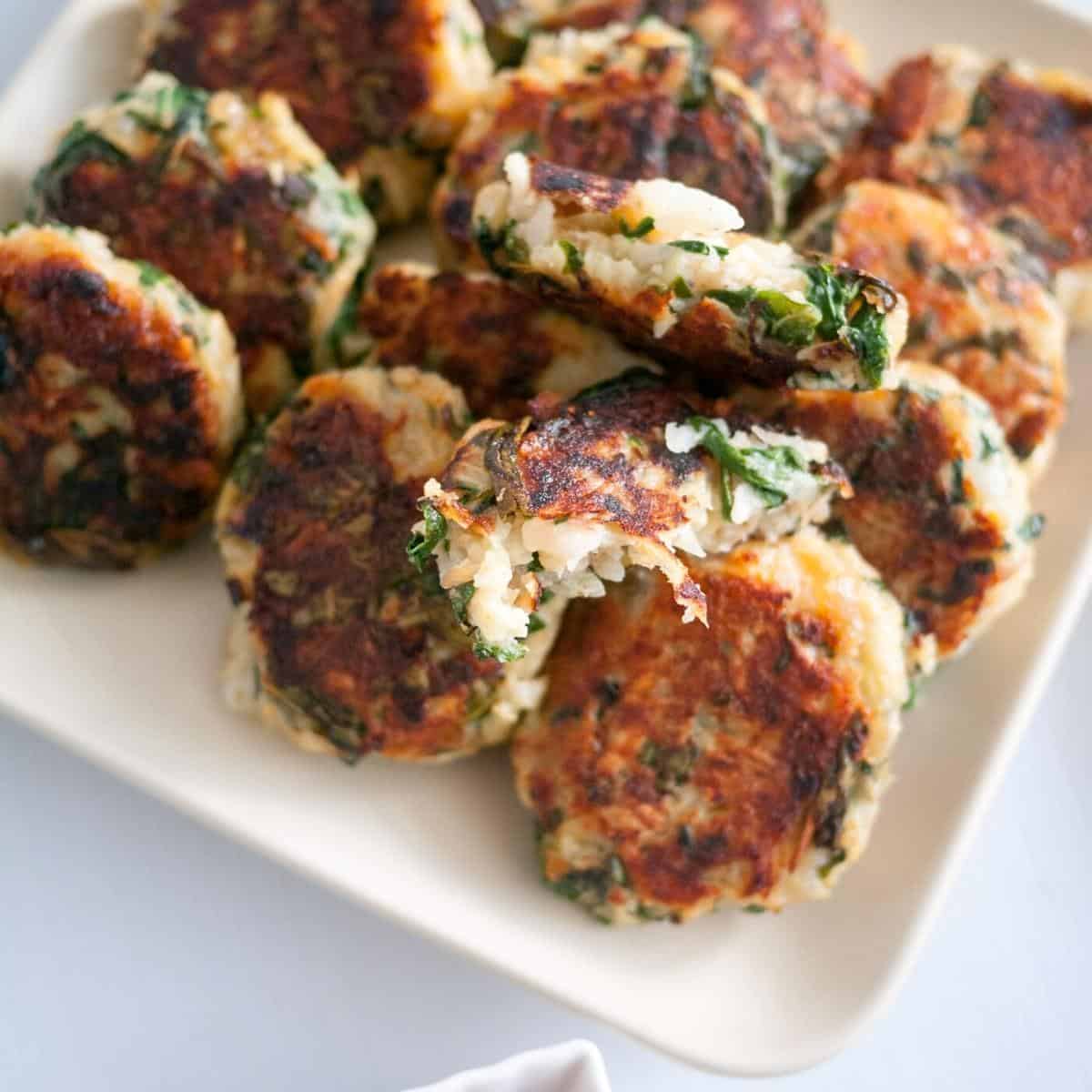 A plate with a Swiss chard patties.