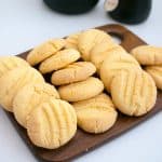 A stack of shortbread cookies on a board.