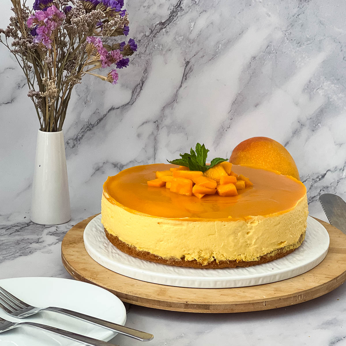 A mango mousse on a cake stand.