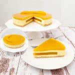 A slice of mango mousse cake on a plate.