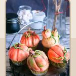 Pinterest image for fondant decorated pumpkin cupcakes.