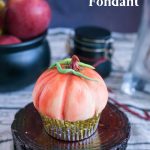 Pinterest image for fondant decorated pumpkin cupcakes.