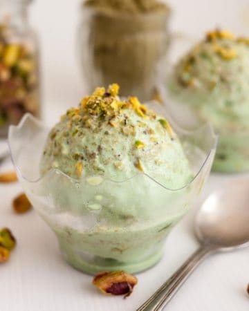 A bowl with no churn ice cream and pistachios.