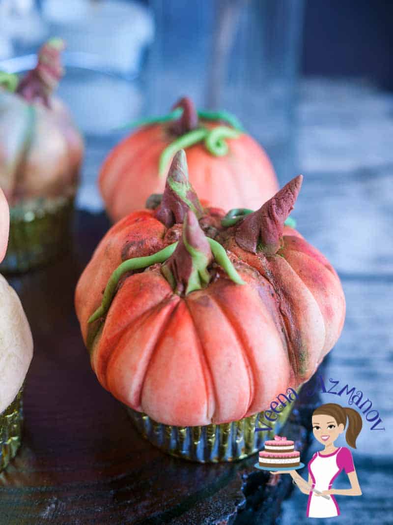 These pumpkin cupcakes are perfect treats to give as gifts to anyone big or small during the season of fall or Halloween. I've used my Pumpkin spiced apple cupcakes recipe and decorated them to look like pumpkins. They are simple easy and adorable as  you can see in the video tutorial. 