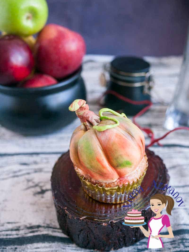 These pumpkin cupcakes are perfect treats to give as gifts to anyone big or small during the season of fall or Halloween. I've used my Pumpkin spiced apple cupcakes recipe and decorated them to look like pumpkins. They are simple easy and adorable as  you can see in the video tutorial. 