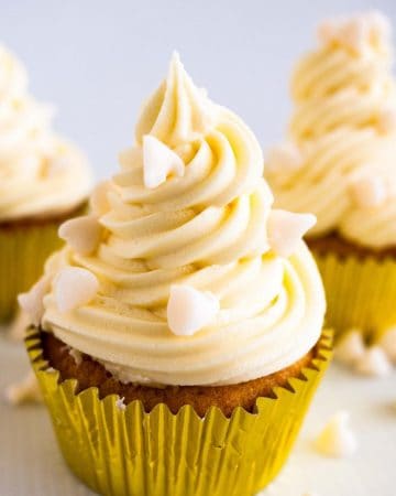 A cupcake with white chocolate frosting.