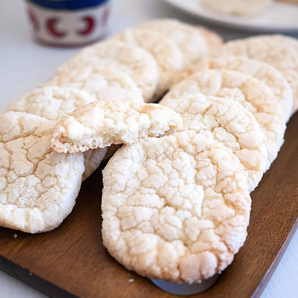 Crinkle cookies on a wooden board.