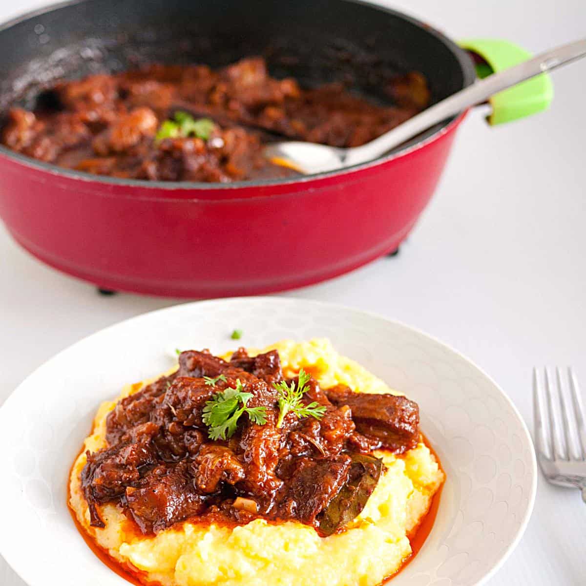 Ragu with lamb on a plate with polenta.