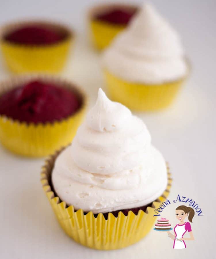 A red velvet cupcake with cream cheese frosting.