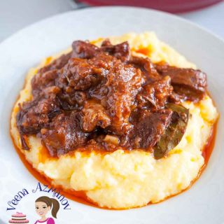 A plate of slow cooked lamb with polenta.
