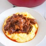 A plate of slow cooked lamb with polenta.
