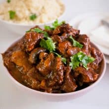Beef burgundy in a serving bowl.